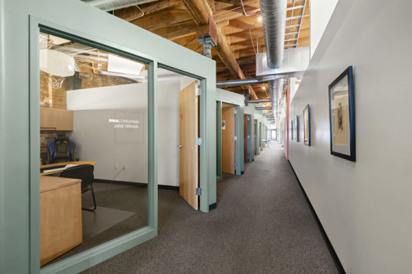 hallway of glass-front offices