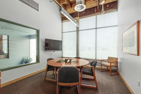 small meeting area with round table and chairs