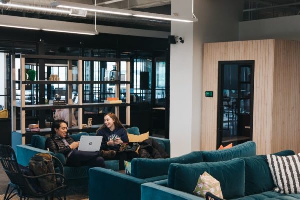 people collaborating on couches inside commercial office