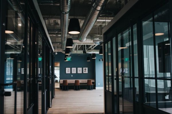 Hallway with multiple meeting rooms inside commercial office